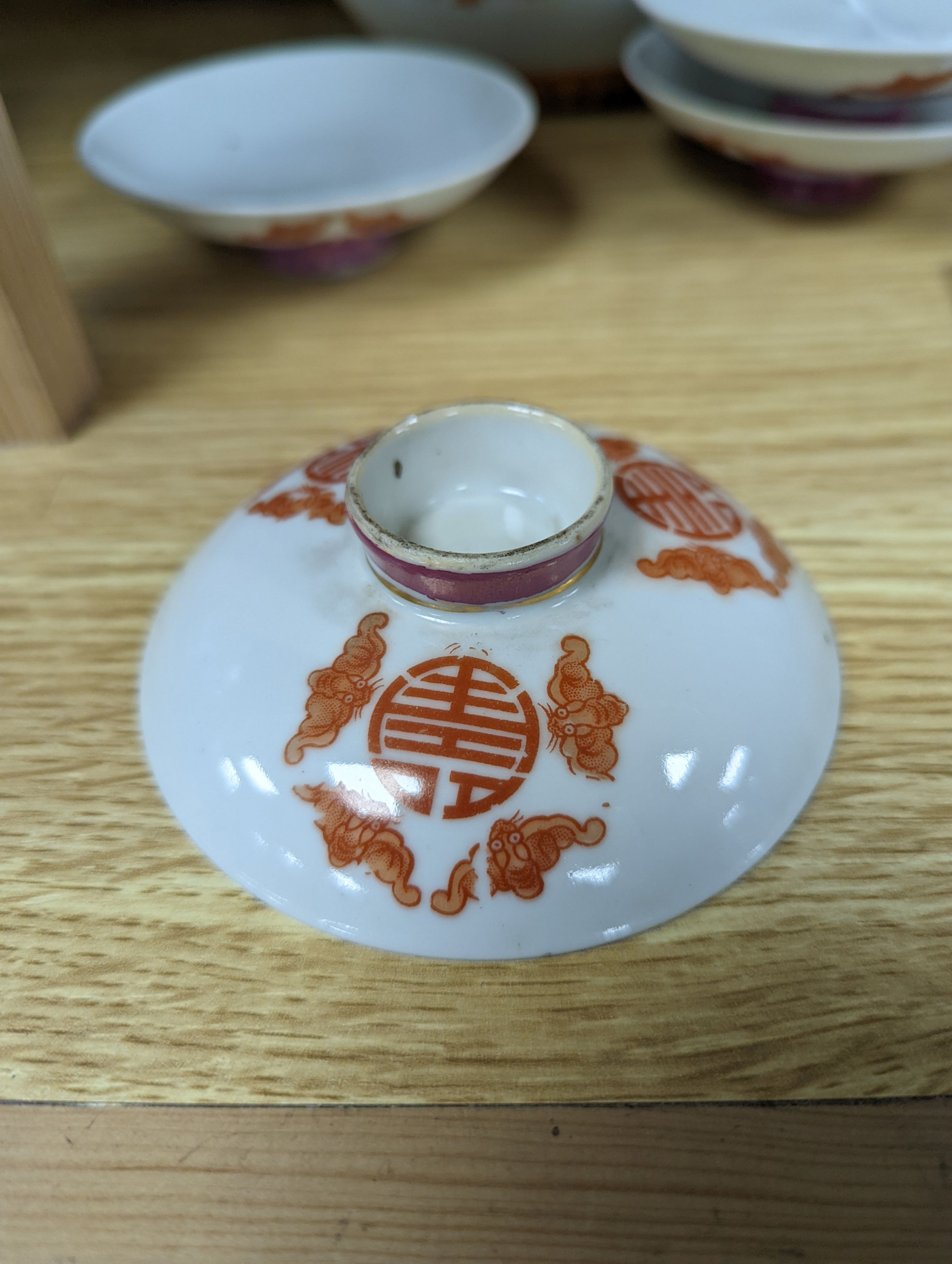 A set of five Chinese teabowls, covers and stands and a similar 'dragon' vase, 23cm